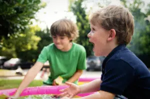 Two children laughing outside